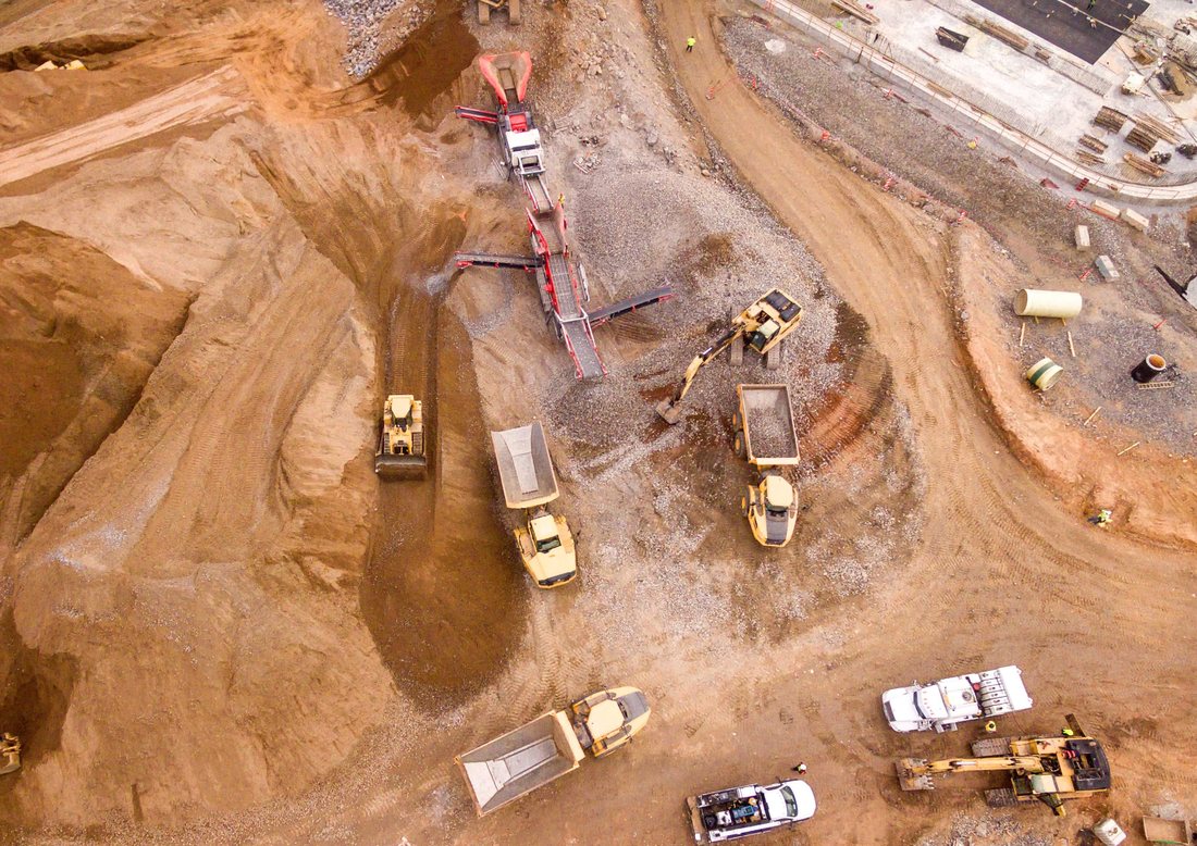 Aerial view of mining quarry with heavy machinery